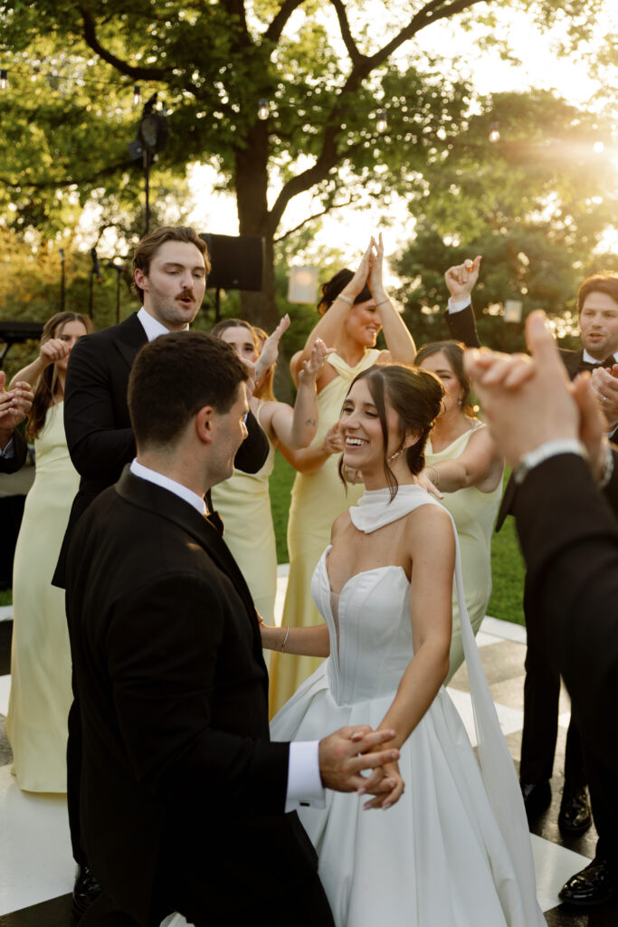 Bride and groom dancing with guests during an Austin wedding reception