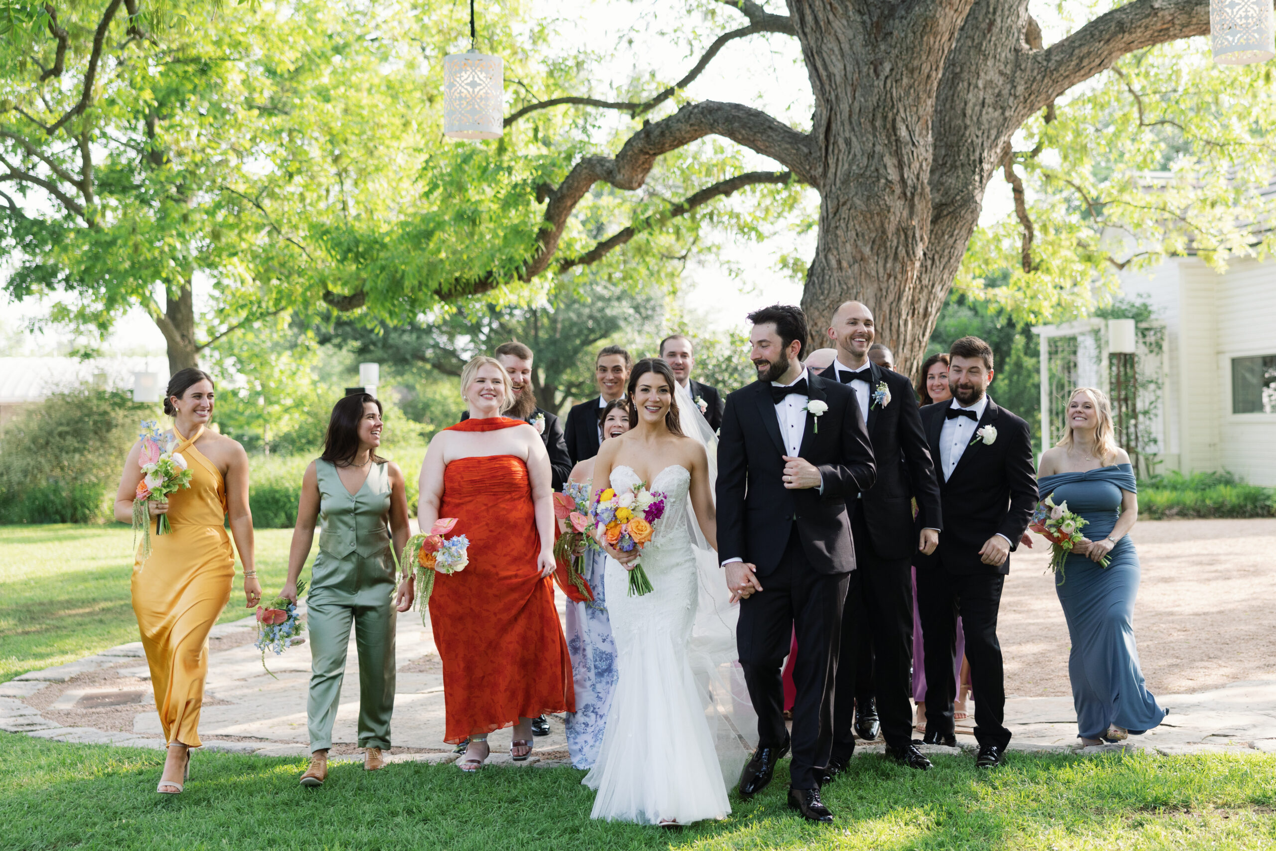 Bride and groom sharing romantic wedding portraits outside Barr Mansion following their ceremony with friends.