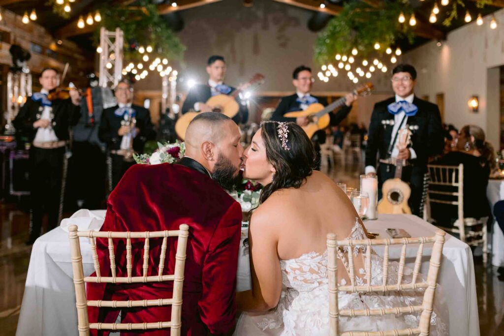 Canyonwood Ridge wedding reception with couple kissing during celebration